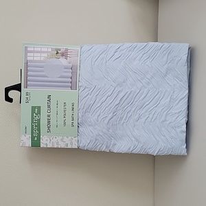 Brand new blue shower curtain.